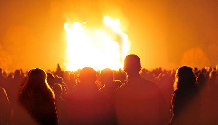 People stood infront of bonfire