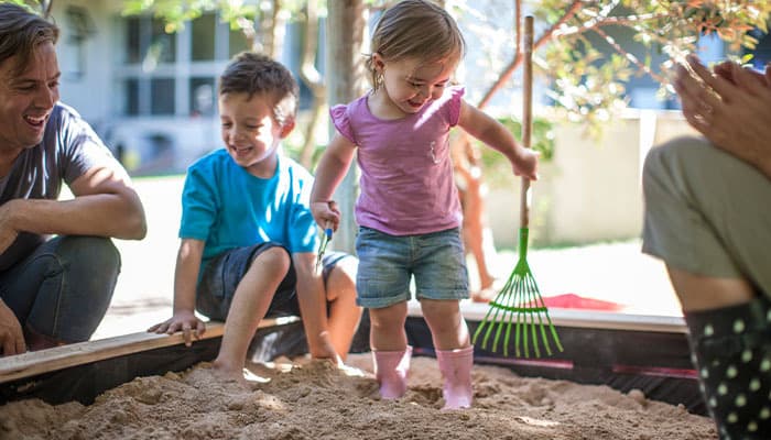 Children playing in a garden sandbox